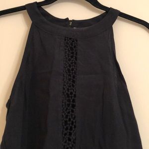 Black tank top crochet goes down through middle